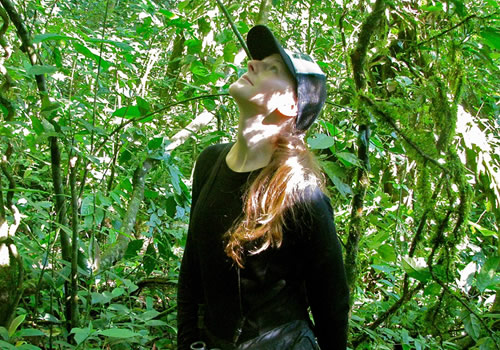 Iulia Bădescu in the jungle watching chimps