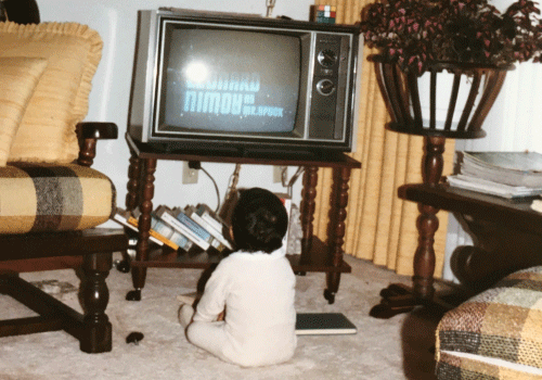 Jamil Sharif as a toddler sitting in front of a tv.