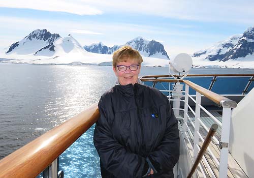 Joan McCalla posing on a ship.