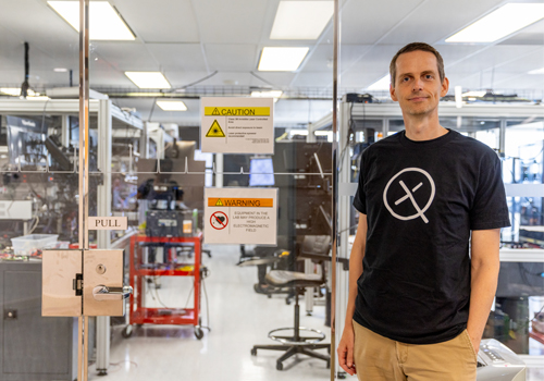 Nathan Killoran standing in a lab.