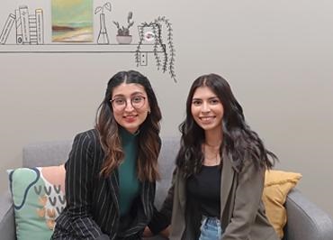 Alumni alumni Nuha Siddiqui and Kritika Tyagi sitting beside each other on a couch