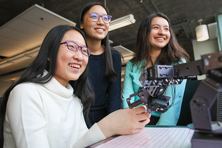 Xiaoxiao (Maddy) Zhang and two classmates.