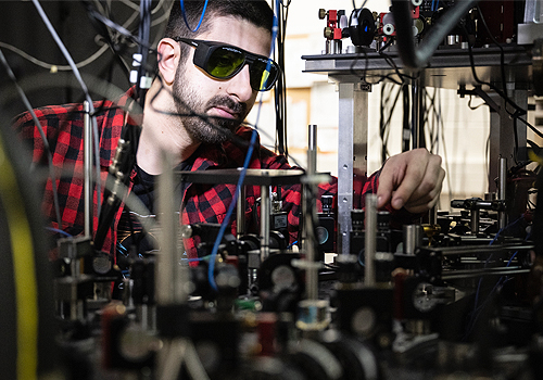 A man making adjustments to a technical device