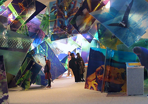 an immersive wall of art display in a museum