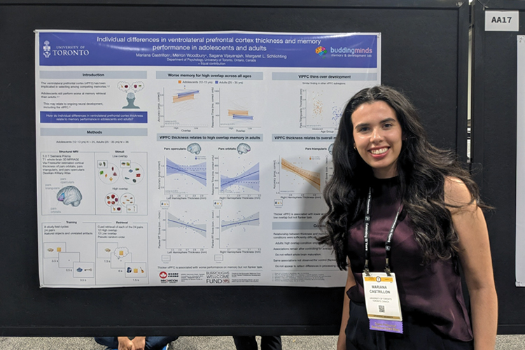 Marianna Castrillon presenting research from a bulletin board.