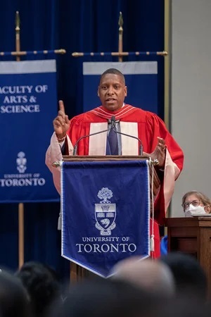 Masai Ujiri in ceremonial robes speaking at convocation