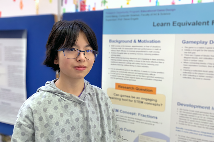 Carol Meng standing in front of her poster