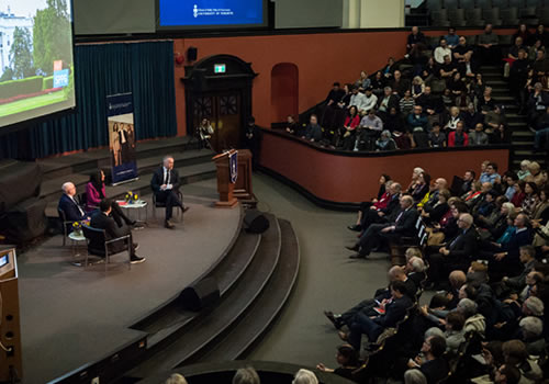 A crowd at Convocation Hall listens to Michael Wolff.