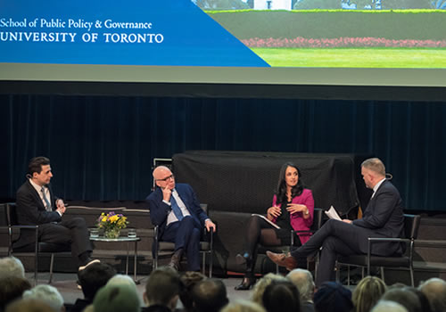 Michael Wolff (second from left) in a discussion with (from left to right) Professor Joseph Heath, Ottawa reporter Althia Raj and SPPG director Peter Loewen, presenting on stage.