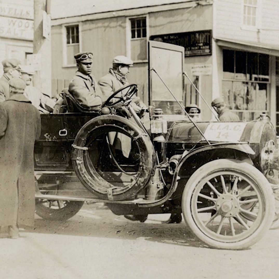 Men in a car in 1920 New York City