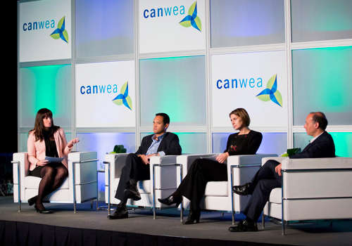 A group of people sitting on a stage.