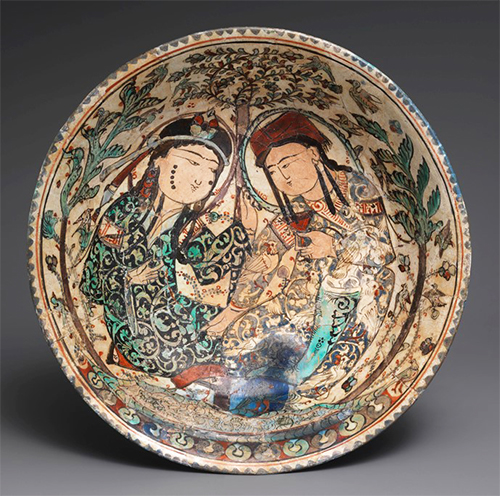 A ancient bowl depicting a couple in a garden