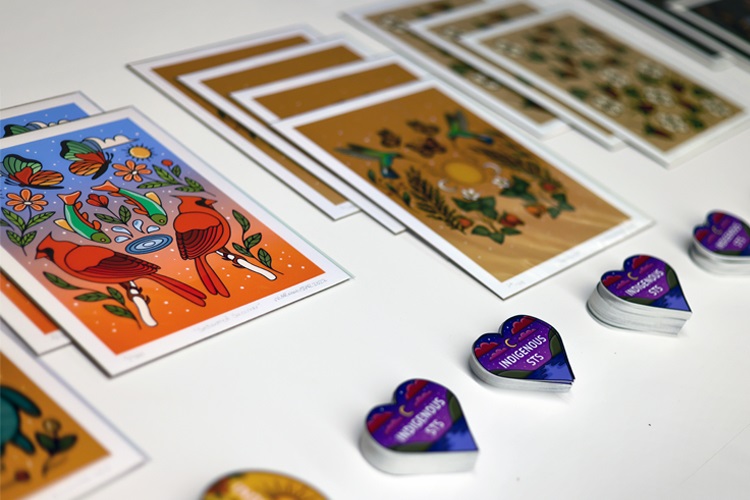  Decorated cards and buttons on a table used by attendees to send notes of support and encouragement to the more than 30 Indigenous scholars who spoke. 