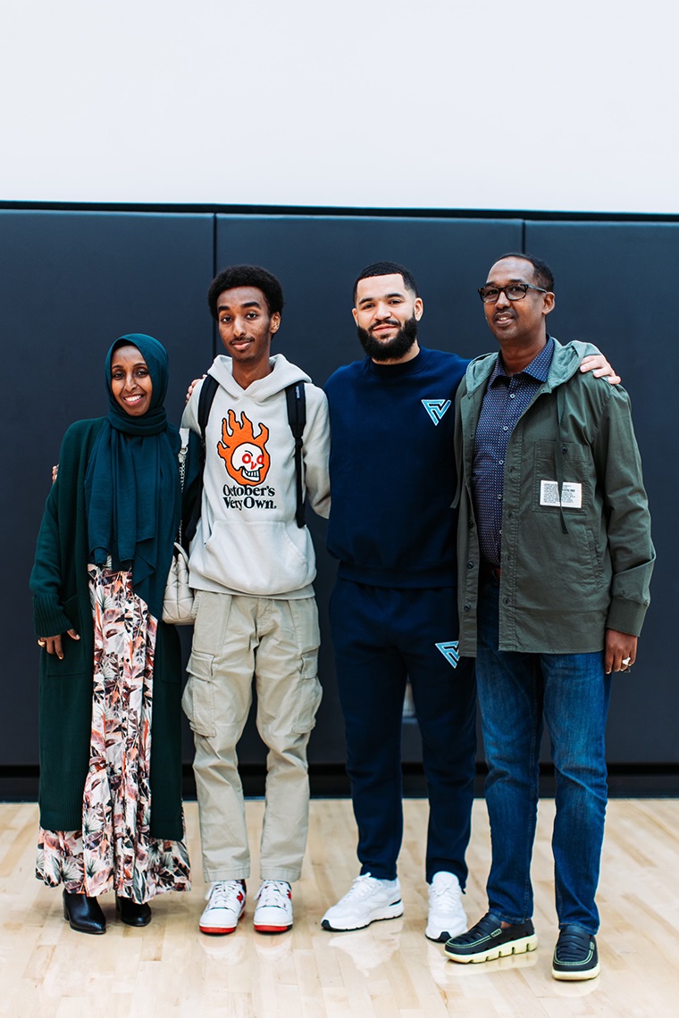 Abdullahi Hassan with his parents and Fred VanVleet  