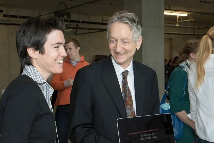 Geoffrey Hinton shares a laugh with fellow AI researcher Raquel Urtasun