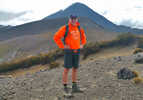 Russ Pysklywec standing beside a mountain.