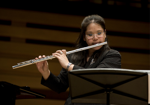 Samantha Chang playing the flute.