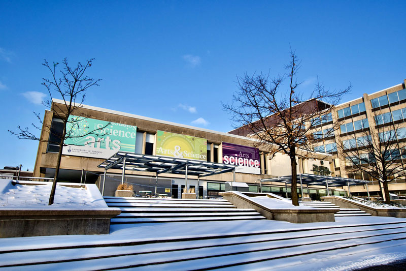 Front of Sidney Smith Hall building covered in snow.