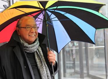 Amos Key Jr. holding a colourful umbrella