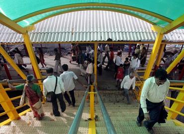 Commuters using the Bandra Skywalk in Mumbai