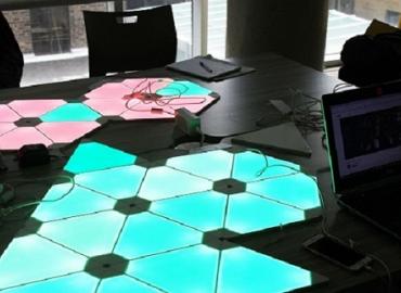 Nanoleaf’s multicoloured Aurora panels lighting up red and blue