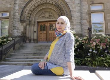Noura Al-Jizawi sits outside of the Munk School of Global Affairs