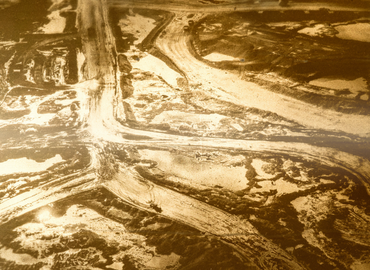 abstract sepia-toned image of a mine crossing