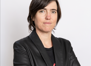 A photo of Raquel Urtasun standing with her arms crossed
