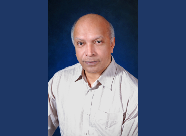 Headshot of Arun Bala wearing a formal shirt