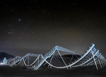 A picture of chime, a magnificent mental structure under a bright night sky.