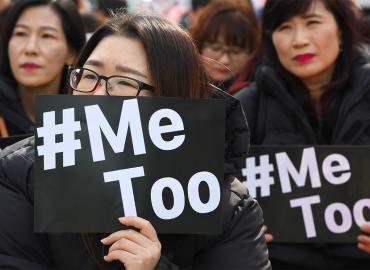 Two women holding banners that say &amp;quot;#MeToo&amp;quot;