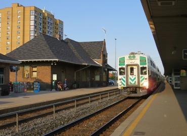 Go train arriving at Brampton during the day.