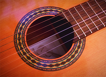 close up photo of an acoustic guitar