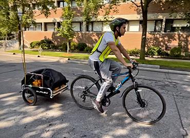 Ibarra Mendez riding their bike down the street.