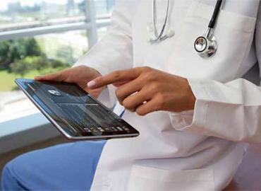 Photo of a doctor on a tablet