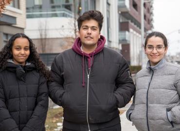 (From left) Regent Park resident Samira Abdi is working on a multimedia project with U of T students Sayem Khan and Lena Sanz Tovar. Photo: Romi Levine.