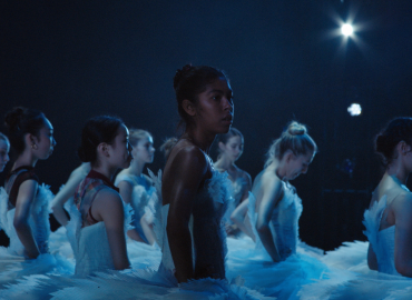 A group of young ballerinas standing off stage