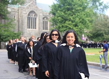 Students from Woodsworth College march in the academic procession to Convocation Hall for their ceremony.