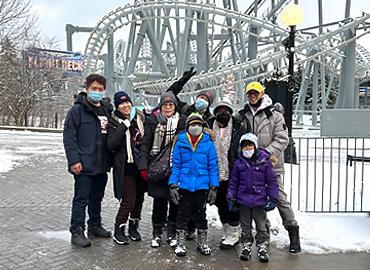 A group of students standing in front of a rollercoaster at Canada&amp;#039;s Wonderland.