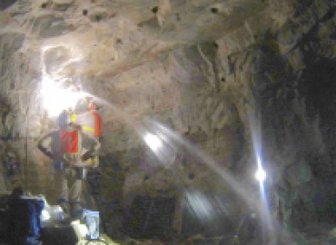 Cave with water spewing out 