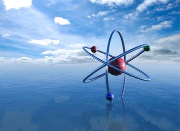 An illustration of an atom showing three blue hoops around a red orb on an ocean.