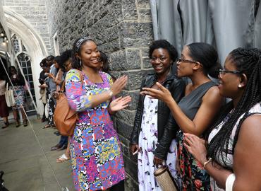 A group of students waiting outside for an awards ceremony.