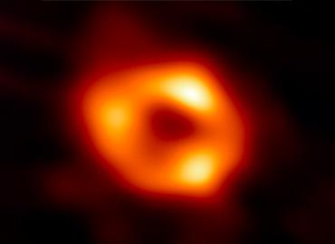 An image of a glowing orange circle-shaped image against black
