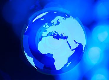 World globe and blue defocused background