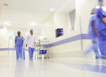 Doctors and nurses walking through a hospital hallway