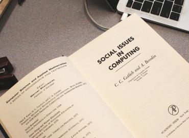 The cover of a book with text that says, Social Issues in Computing.