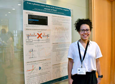 Daniela Angulo standing in front of her research poster
