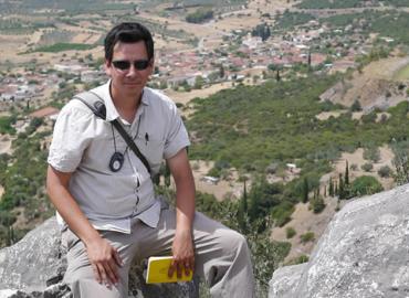Photo of: Dimitri Nakassis atop a hill in Greece