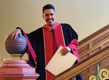 Filippo Sposini standing on the stairs.