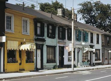 Row of store fronts and houses in Toronto&amp;#039;s old Gerrard Village
